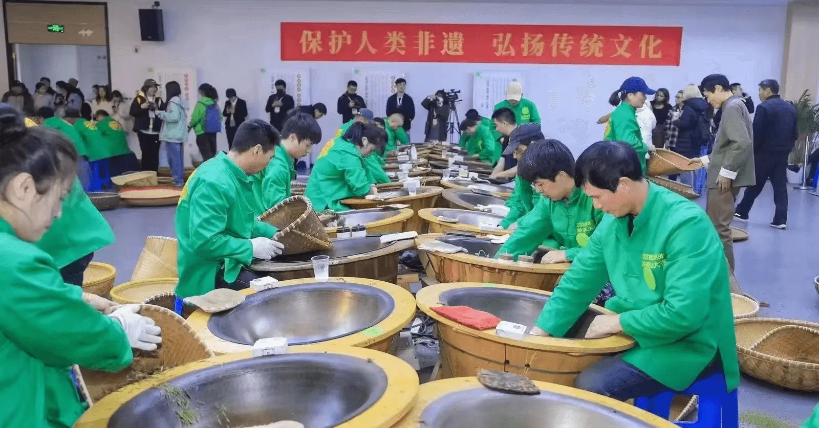 people performing hand-fried Longjing tea